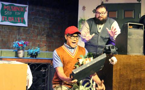 Sentinel Photo/Jessica Shepard Seymour Krellborn (Ray Garcia), left, makes a comedic entrance when bringing Mr. Mushnik (Matthew Boren), right, a tray of plants to show off his work progress as part of the Community Actors of South Texas (CAST) press night preview of "Little Shop of Horrors" Aug. 1. Tickets for the production are limited and selling out fast online. 