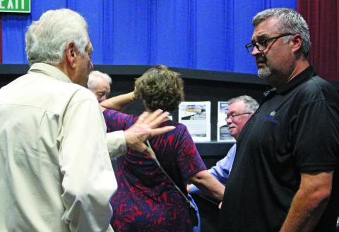 Sentinel Photo/Jessica Shepard Lynn Engineering owner Stuart Lynn, left, talks with an audience member after his luncheon presentation on Aug. 20. The lunch was sponsored by the Bay City Community Development Corporation and featured Lynn’s five tools for successful business growth as the topic. 