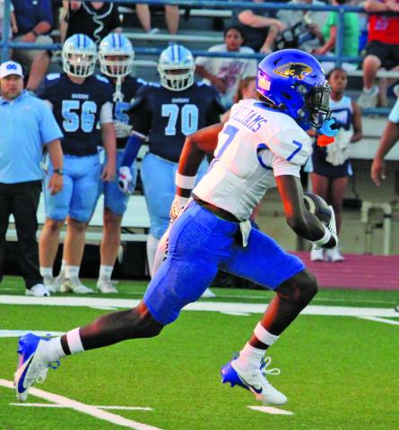 Sentinel Photo/Mike Reddell Bay City senior wide receiver Xylan Williams (7) takes off on 70-yard punt return for a touchdown in the first quarter