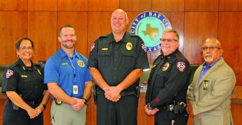 Sentinel Photo/Mike Reddell Police Chief Christella Rodriguez, far left, announced promotions of four officers, from left: James King, Stephen Lunsford, Robert Pierce, and Richard Morales.