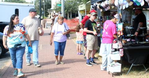 Sentinel Photo/Jessica Shepard Vendors lined the Matagorda County Courthouse offering a variety of wares Saturday, Oct. 26. Among holiday decor, children's toys and various food stalls were several apparel vendors like above.
