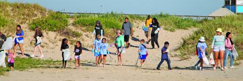 Sentinel Photo/Mike Reddell Volunteers spread out for the Adopt-A-Beach at Matagorda Beach Saturday, Sept. 28.