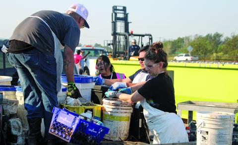 Sentinel Photo/Mike Reddell Workers with Clean Harbor - the waste disposal company the county contracts for the Household Hazardous Waste Collection event  - unloads various chemicals at the collection site at the Matagorda County Fairgrounds Saturday, Oct. 12.