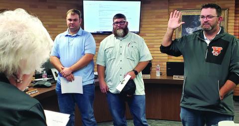 Sentinel Photo/Jessica Shepard Van Vleck ISD Superintendent Secretary Pat Hackworth, left, swore in three board members during the district's monthly trustee meeting Dec. 18. From left is Position  7 Dane Evans, Position 6 Charlie Hill, and Position 5 Casey Kile - all trustees were unopposed in the Nov. 5 election.