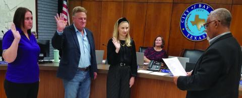 Sentinel Photo/Mike Reddell Mayor Robert Nelson, right, swears in three new appointees at City Council’s Nov. 12 meeting. The three were, from left: Angela Hadash, Deputy City Secretary; Bruce Krauskopf, Planning Commission board; and Melody Ann Yates, Bay City Housing Authority board. 