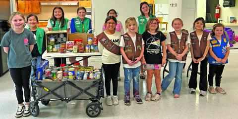 Contributed photo Bay Pals Girl Scout Troop #156991 collected can goods and non-perishables to help local BCISD students in need for the 1st annual can food drive. “With the upcoming holidays, we know there are many kids in Matagorda County that need a little more help,” said Troop Leader Nina Hernandez.