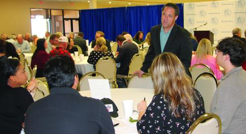 Sentinel Photo/Jessica Shepard Texas Comptroller Glen Hegar visits with Matagorda County Youth Leadership Class members prior to his chamber luncheon talk last week.