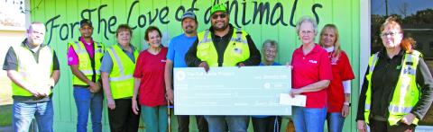 Sentinel photo by Jessica Shepard GFL Environmental personnel presented For the Love of Animals volunteers with a $2,500 check on Friday, Dec. 20. The check comes from "The Full Circle Project" - GFL's community charity program.