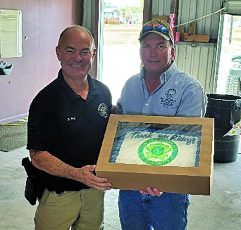 Precinct 2 staff had a special presentation for Precinct 2 Constable Ricky Bort at the precinct's Christmas recent lunch, recognizing Bort's help to the precinct. Shown are Bort, left, with Precinct 2 Commissioner Mike Estlinbaum Contributed photo