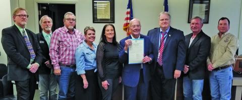 Sentinel Photo/Mike Reddell Commissioners Court honored Judge Ben Hardin, center, with a resolution noting his fairness, long years of service and being a good listener.
