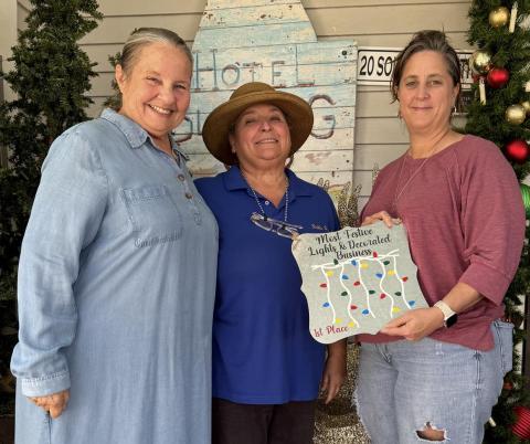 First place winner for "Best Decorated Business" was the Hotel Blessing, represented by Mary Pierce, left, Debbie Davant, center, and Jedie Zarate. Not pictured, second place winner First State Bank,  and third place winner Split Ends Contributed photos