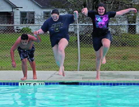 Sentinel Photos/Jessica Shepard This year's "Polar Plunge" featured three brave souls jumping into 64-degree waters at Hilliard Pool, Saturday, Jan. 4.  Interim Parks & Recreation Director Kelly Penewitt said it was the warmest water temperature they have had for the event.
