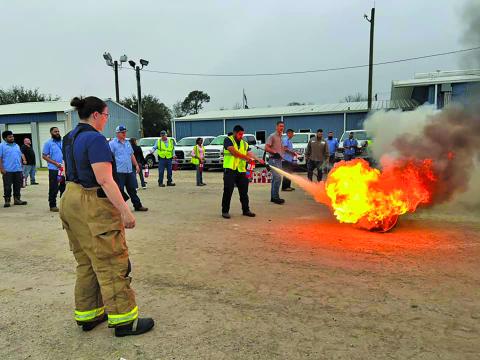 Contributed photo All City Staff got a turn practicing putting out a controlled diesel fire last week.