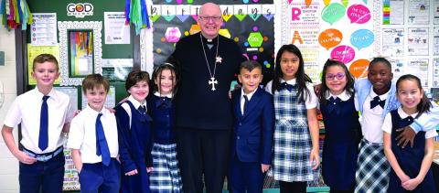 Holy Cross Catholic School photo Bishop Brendan J. Cahill recently made his annual visit to Holy Cross Catholic School to meet and visit 3rd graders. He admired PreK-4 B's coloring pages of the Irish priest Brendan the Navigator of Clonfert - the bishop’s namesake. 