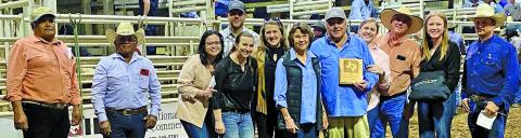 Contributed photo The 2025 “Cattlemen of the Year” title was awarded to Harold Bowers, center, with his wife Cheryl Bowers, who together have farmed grain, farmed seafood, and have raised up to 800 head of cattle on 3,000 acres of land.