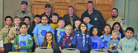 Courtesy photo Cub Scouts - Pack 4545 - held their annual Blue and Gold Picnic at First Methodist Church on Saturday, Feb. 22.  The event’s guest speakers: Deputy Jimmy Hausler and Game Wardens Colten Anderson, Aaron Koenig and David Janseen (Back row).