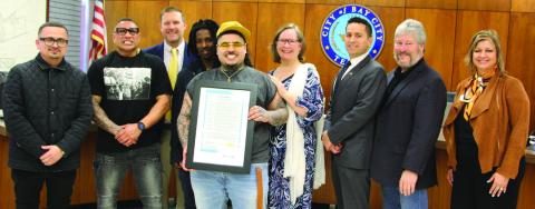 Sentinel Photo/Jessica Shepard The City of Bay City proclaimed Feb. 25 as “That Mexican OT Day” at the start of the city council meeting on Feb. 25. That Mexican OT - Virgil René Gazca, center, holds a framed copy of the proclamation.