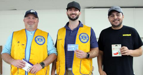 Sentinel Photo/Jessica Shepard : Several adults and teens raced to devour 10 pancakes at the Bay City Lions Club's annual "Pancake Supper" on Thursday, March 27. First through third-place honors went to, from left, John Miller, Ryan Leissner, and Benji Mata. 