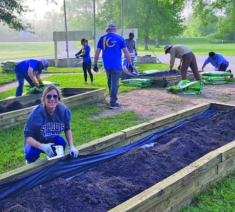 LCRA photo LCRA employees work on the butterfly and wildflower gardens at Riverside Park in Bay City during LCRA’s Steps Forward Day on April 11. 