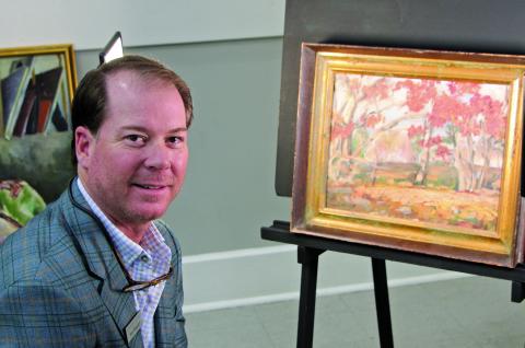 Sentinel Photo/Mike Reddell Houston art appraiser Ray Simpson with one of 45 known or suspected Forrest Bess paintings brought in by several Matagorda County residents last week.