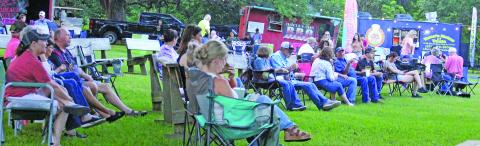 There was quite a crowd enjoying the food, fun, and tunes at the Matagorda Birding Nature Center's "Arbor Day Food Truck Festival" Friday, April 25. Attendees also had their choice of beer, wine and other beverages, too.  Sentinel Photo/ Jessica Shepard
