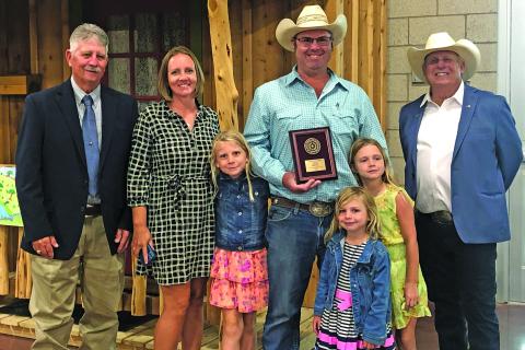 Matagorda County Soil & Water ConservationDistrict #316 Ryan Hickle shows off his Runner Up Award in the Conservation Farmer catgegory for Area 3.