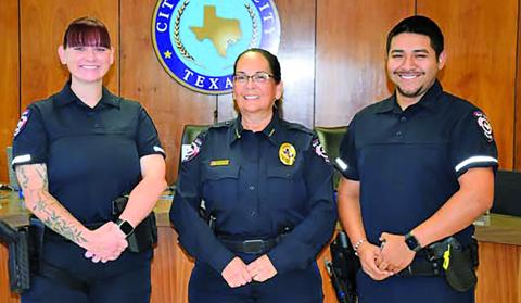 Contributed photo Police Chief Christella Rodriguez, center, recently swore in two new Bay City Police Department officers. They are, Demi Bujnoch, left, and Efrain Robles.