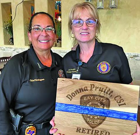 Bay City Police Departmetn celebrated the retirement of  Donna Pruitt, CSI, left, with Police Chief Christella Rodriguez. “Her hard work and dedication were definitely defining factors of her tenured career here at BCPD,” the chief said. Contributed photo