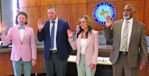 Sentinel Photo/Mike Reddell City Council members are sworn in last week following the May 3 election. Shown, from left, Council Members Bradley Westmoreland, Blayne Finlay, Susan Reardon and Mayor Robert Nelson.