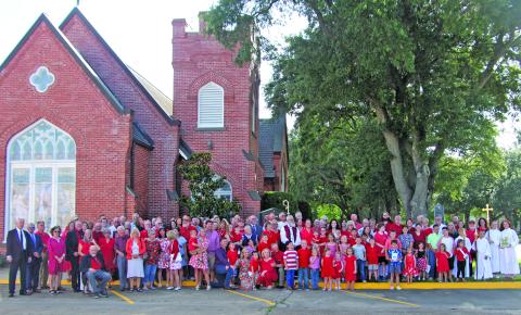 Sentinel Photo All the St. Mark’s Episcopal Church members present for the Sunday service gathered afterwards in front of the church at the corner of Avenue E and 6th Street for a church family photograph by a drone that was scheduled to photograph the members on this special day. 