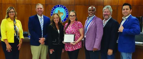 Sentinel Photo/Jessica Shepard Municipal Court Administrator Katie Plunket, center, was recognized for her Texas Municipal League "Leadership Fellow" certification at the city council meeting last Tuesday, July 8. 