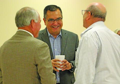 Sentinel Photo/Jessica Shepard Chuck Kharrl (center) laughs with Mitch Thames, left, and George Harrison.