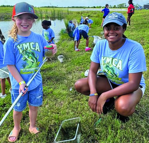 Contributed photo Sea Grant intern Trinity Jones is shown helping YMCA campers this summer.
