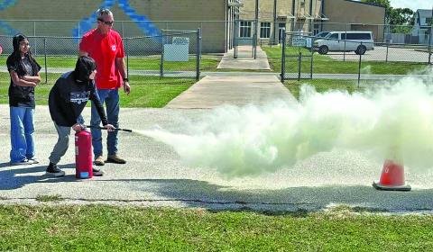 Contributed photo Matagorda Volunteer Fire Department came to Matagorda Elementary School to teach students about fire safety during Fire Prevention Week. The kids put out “fires” with the fire hose and were able to use other methods of fire suppression. 