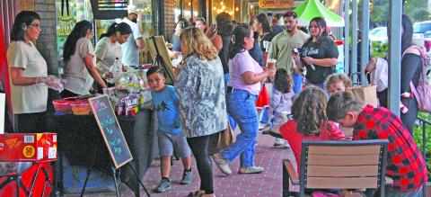 Sentinel Photo/Jessica Shepard Bay City Main Street Program's annual "Christmas Around the Square" returned to downtown on Thursday, Nov. 20. Local businesses and organizations were full of Christmas cheer and drew quite the crowd during the event. 