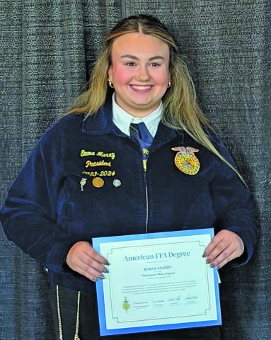           Photo courtesy of FFA Tidehaven FFA member Emma Murray shows off her American FFA Degree