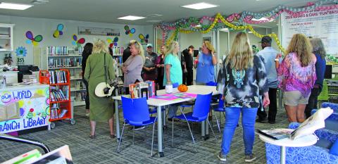 People mingle and talk before the Sargent Community Center groundbreaking begins Monday afternoon, Nov. 3. Sargent residents welcome the construction of the new center that will be built behind the present library. Ultimate plans call for the library to be located in the Community Center. Sentinel Photo/ MaLinda Reddell