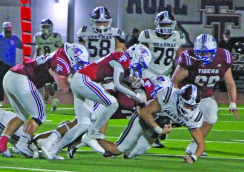 Sentinel Photos/Jessica Shepard Tiger team tackling brought down this East Bernard running back last Friday night.