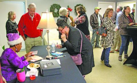 Sentinel Photo/Jessica Shepard New and returning Community Actors of South Texas (CAST) patrons sign up for the 2026 production season during CAST's 'Premiere Night' event Dec. 2.