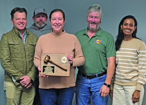 Sentinel Photo/Jessica Shepard Bay City Community Development Corporation presented a service award plaque to past BCCDC Executive Director Jessica Russell, center, on Friday, Jan. 16. Russell is joined by board members Bradley Westmoreland, Clint Hewitt, BCCDC Board President Jim Folse, BCCDC Board Vice President Erandi Allison.