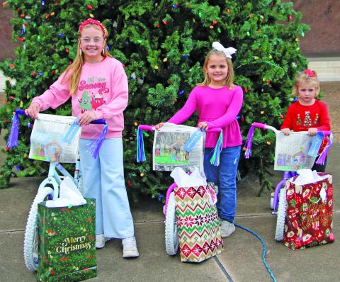 Sentinel Photo/Mike Reddell These three girls are the winners in the Bay City Sentinel’s Annual Christmas Coloring Contest. They are, from left: Hayden Jones, 9-12 age category; Kate Bartek, 5-8 category; and Brynn Mach, 2-4 category.