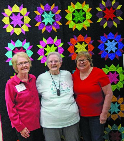 Sentinel Photo/Mike Reddell Memory Makers Quilt Guild Show winners were recognized at the annual show exhibition on Jan. 28. Winners posed with this year’s raffle quilt, from left are Barbara Micaletti, second place; Shirley Rogers, first place; and Sue Felix, third place.