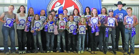  Sentinel photo/Jessica Shepard  Matagorda County Fair and Livestock Association's Home Economics food entry winners received purple rosettes for their win as Grand Champions of their chosen divisions Saturday, Feb. 28. Winners include Raelyn Owen, Ellie Hutto, Abagail Straub, Meredith Jones, Aubree Savage, Olivia Mitchell, Ashley Alford, Drake O’Connell, Abigail Jurek, Ellie Curtner, Jase Alford, Aribella Carson, Jayci Downs, Keagan Gerberman, Taylor Martinez, Savannah Remmy, and Jace Reynolds.