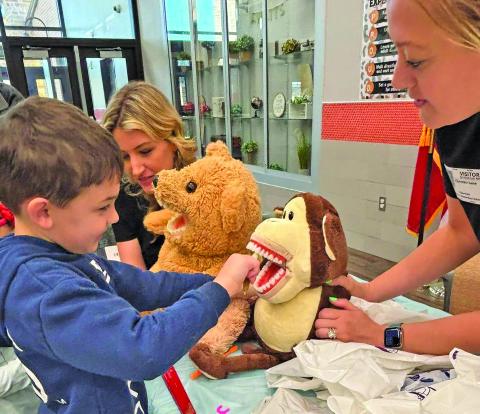 VVISD Photo Van Vleck High School Health Science Teacher, Kim Wied, along with her Health Practicum and Theory classes, held the annual Teddy Bear Animal Clinic at Van Vleck Elementary recently. Also assisting were Mrs. Erron Steinmann, Mrs. Missy Jurek, and Mrs. Lyndee Owen. Kindergarten students participated in activities with their own stuffed animals including learning about dental hygiene, xrays, and wellness checks to help them understand how healthcare professionals help us.