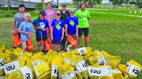 Contributed photo Cub Scout Park 4545 were among the 50 volunteers who gathered along the shoreline of Palacios Bay Beach, working together to remove nearly 200 pounds of trash and filling 43 bags in the process on April 18.