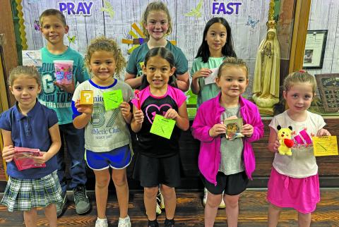 Holy Cross Catholic School Photo Eagles of the Week: Luke Novak, Maryclare Bricker, Nadia Flores, Allyine Frick, Zina Wilkenson, Bianca Gomez, Adelyn Sutherland, and Emilia Ursery.