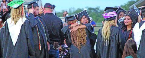 Sentinel Photo/Jessica Shepard Van Vleck High School graduates celebrate at Burl McKinney Stadium Thursday, May 21.