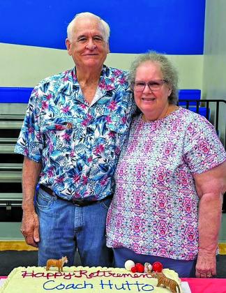 Contributed  photo The Tidehaven community honored Coach Robert Hutto, shown with his wife Nancy, with a retirement celebration at the Tidehaven Dome Saturday, June 6, Hutto was recognized for his 52 years at Tidehaven ISD and 54 years in coaching and teaching. Family, friends, former students, players and community members gathered for the celebration.