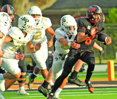 Anna Hernandez photo Leps’Brock Van Dyke (8) breaks free from a block of Panther defenders during the game Friday night against Anahuac. 