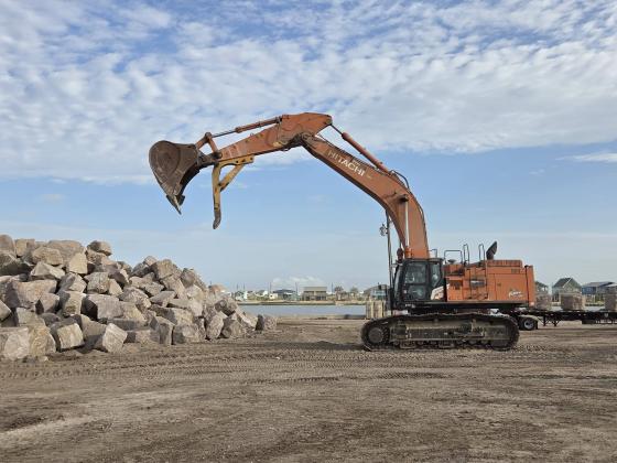 JP 6 Constable Bill Orton photo Precinct 6 Constable Bill Orton posted this photo of the excavator at a giant pile of granite that will be used for the breakwater project at Sargent Beach.